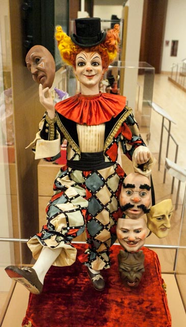 a photo of a harlequin clown doll