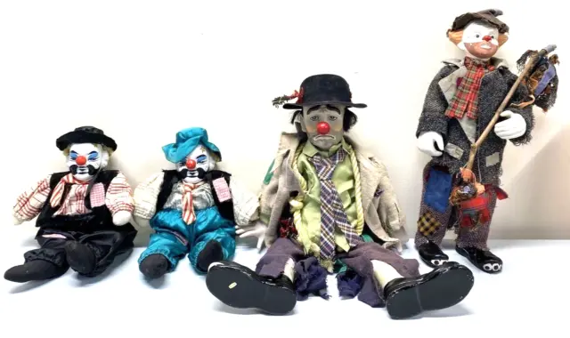 a photo of several different hobo clown dolls