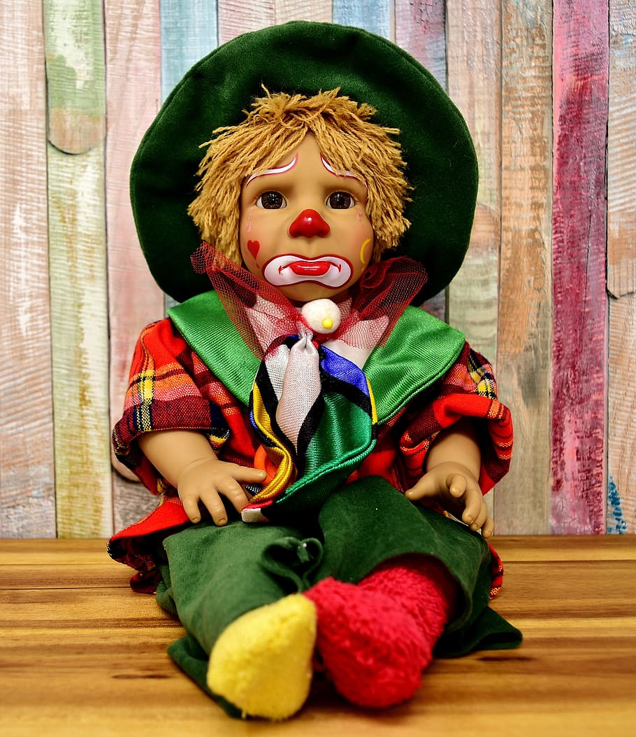 a photo of a sad clown doll